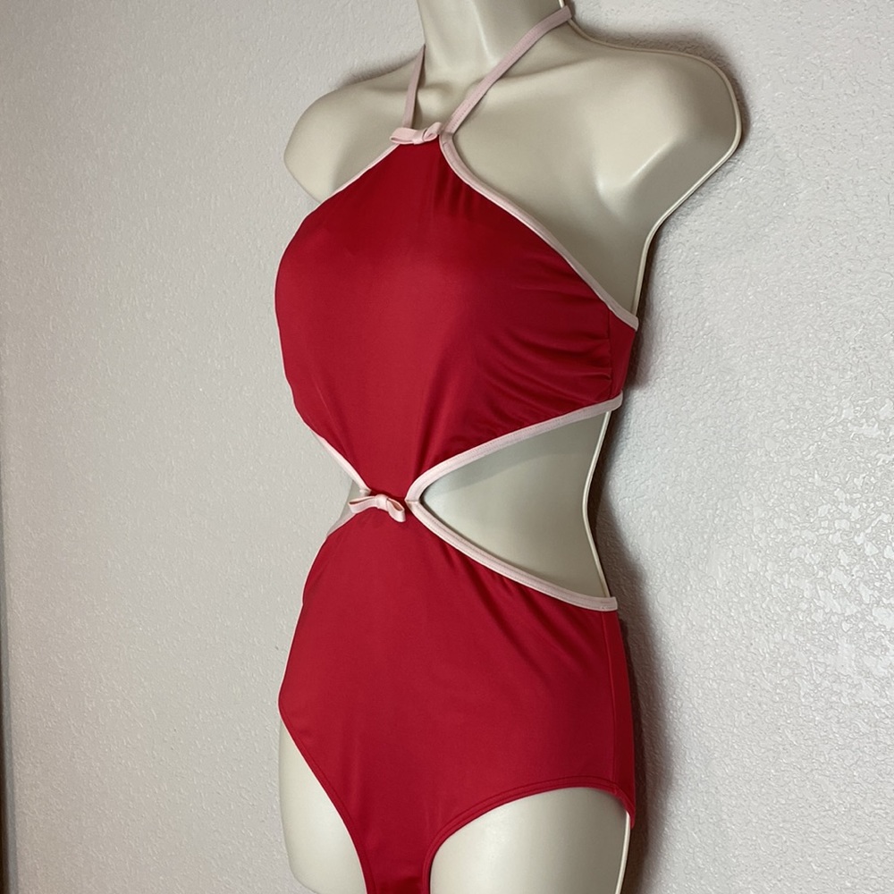 Kate Spade, red, one piece swimsuit with peekaboo cut outs on the side.